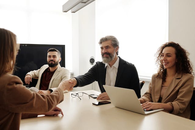 people shaking hands during a meeting